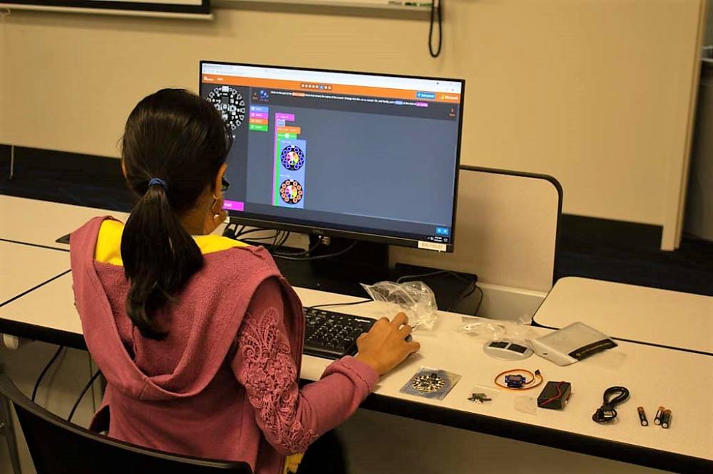 A student participates in a project with an online component